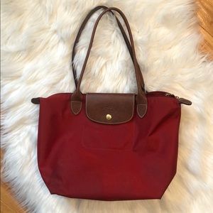 Small sized red longchamp bag, gently used.